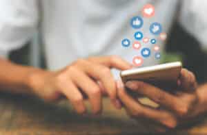 A social media user interacts with content on their mobile app