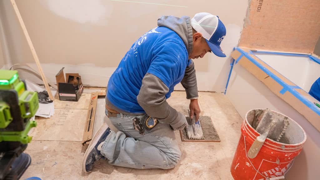 Express Kitchen and Bath remodeler works on a bathroom
