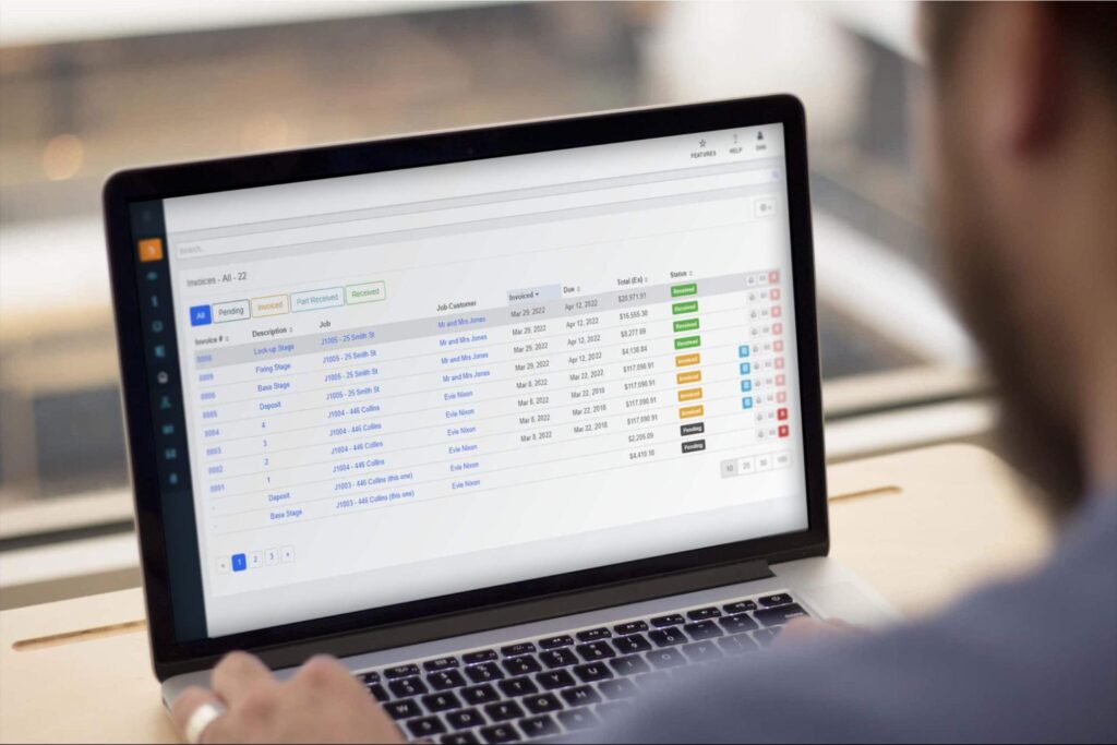 Picture of construction estimating software on a laptop at a job site.