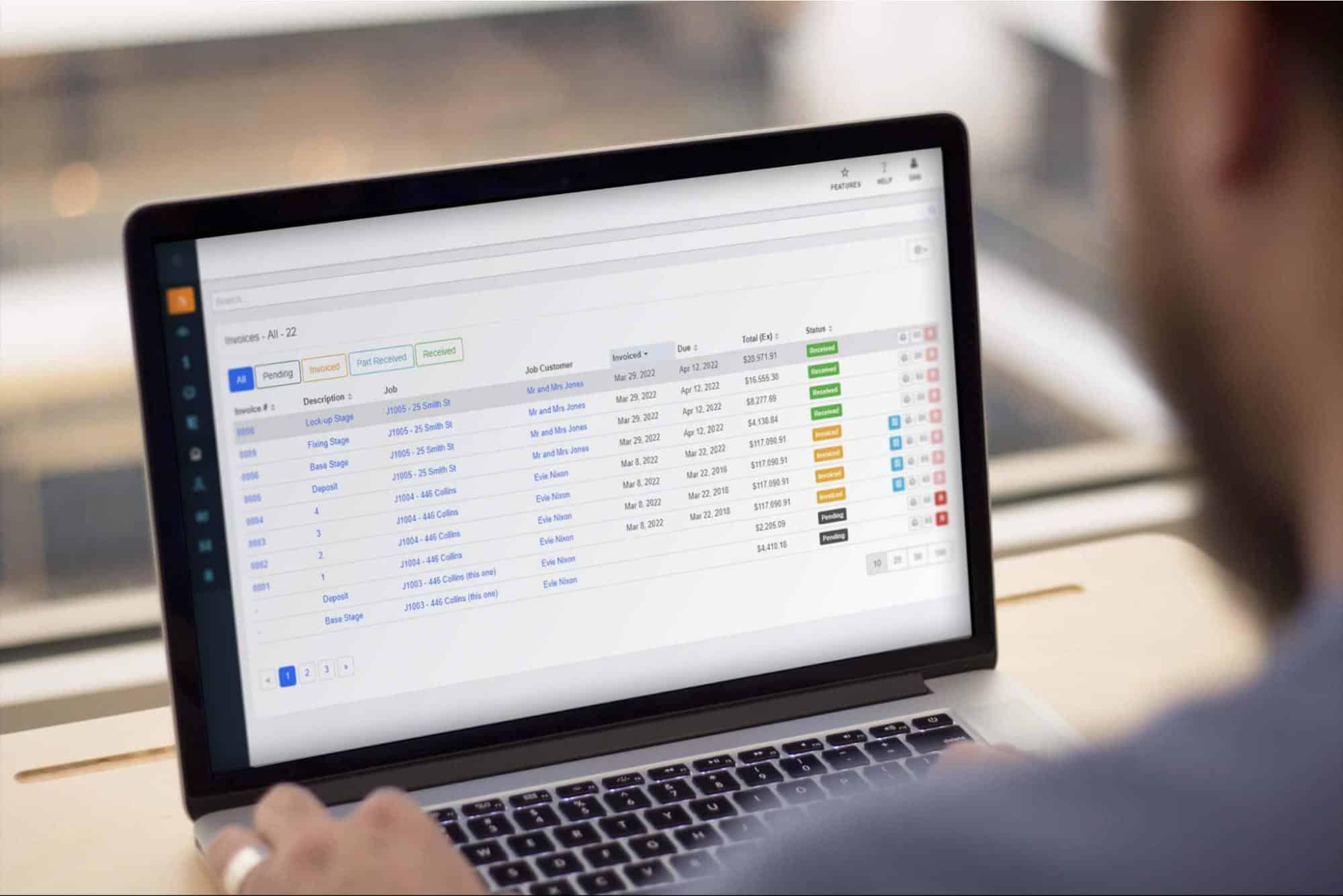 Picture of construction estimating software on a laptop at a job site.